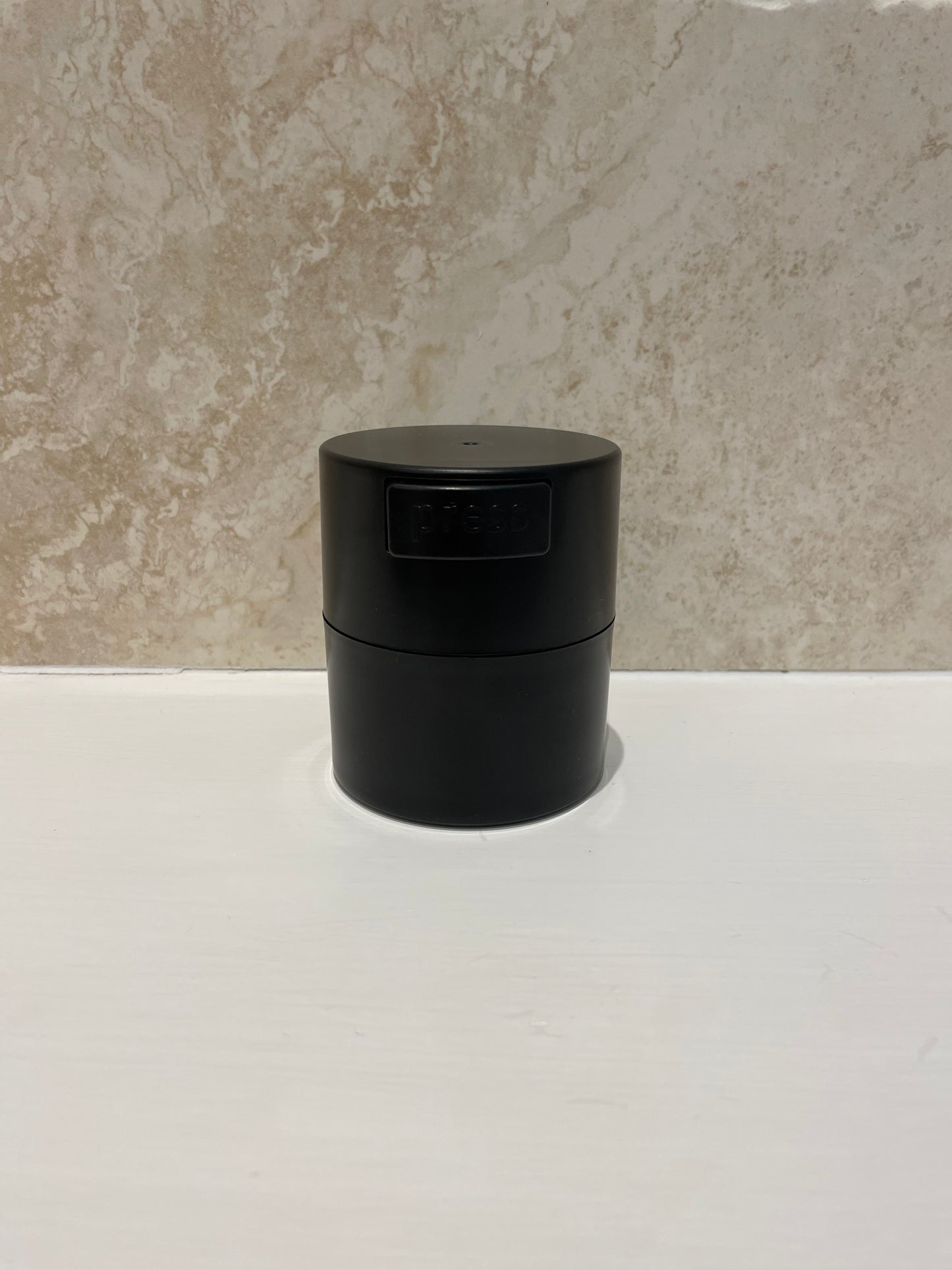 Adhesive storage container